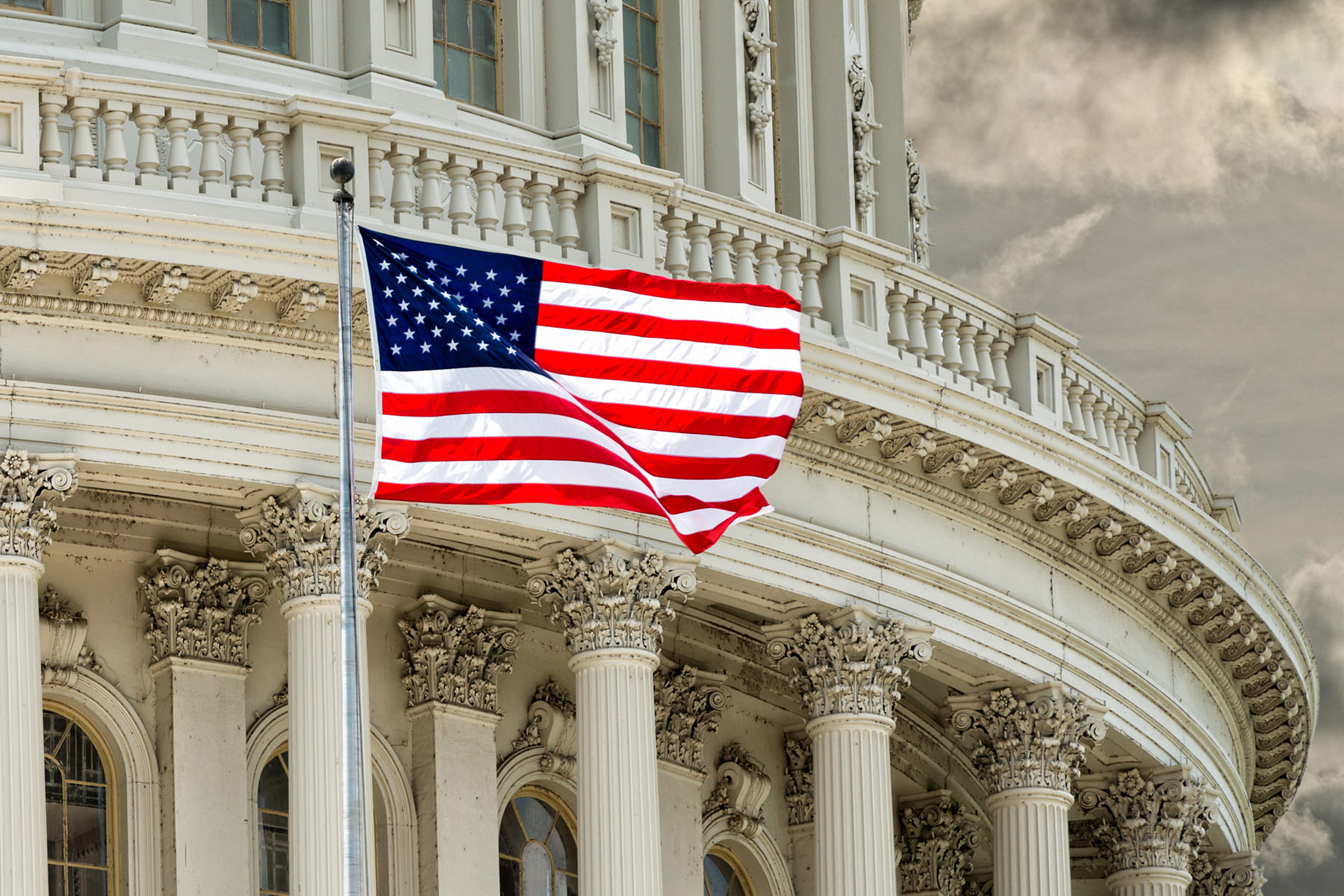 American flag in front of US Capital Building